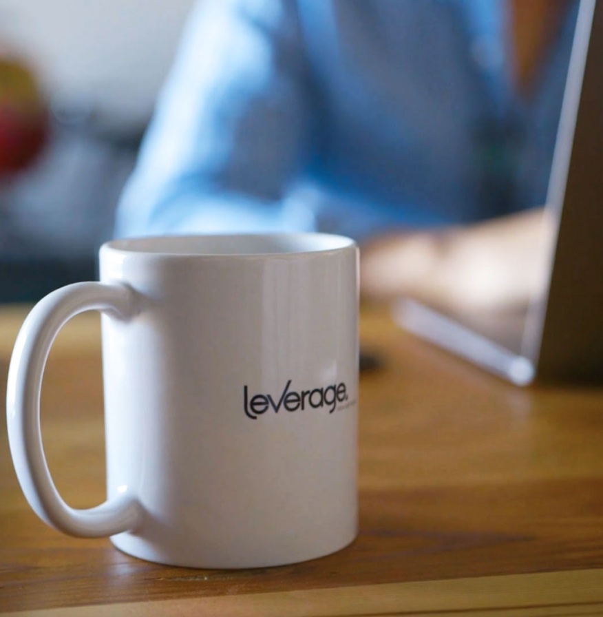 Leverage branded mug on desk